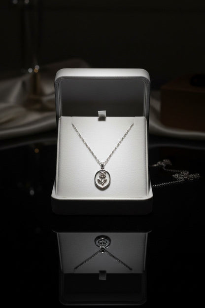 Ownline Galleria sterling silver oval pendant necklace with rose engraving in a gift box.